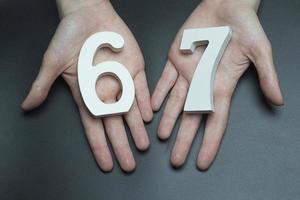 To female hands the number sixty-seven.