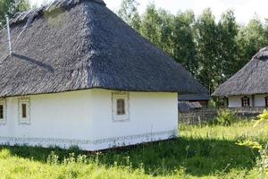 Old houses with thatched roofs. photo