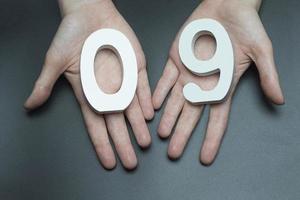 To female hands the number nine. photo