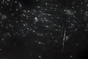 Fireworks in the night sky on a holiday. photo