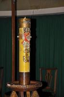 Close-up of lit candle with image of Jesus Christ in the Santuario das Almas church, in the coastal city of Niteroi. Located in the Rio de Janeiro State, southwestern Brazil photo