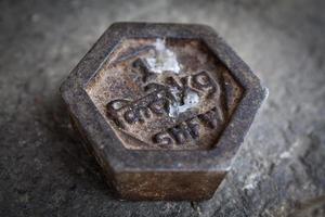 Iron 1 kilogram weight in Bhutan, with the following text Bhutanese kilogram and kg, in Southeast Bhutan, Asia photo