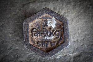 Iron 1 kilogram weight in Bhutan, with the following text Bhutanese kilogram and kg, in Southeast Bhutan, Asia photo