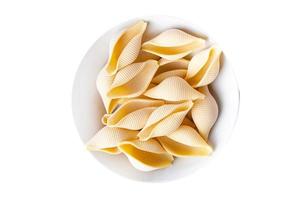 Conchiglioni raw pasta royal seashells food background photo