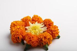 Marigold Flower rangoli Design with green leaf for traditional Festival. photo