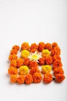 Marigold Flower rangoli Design with oil lamps for Diwali Festival. photo