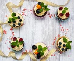 Cupcakes with fresh berries photo