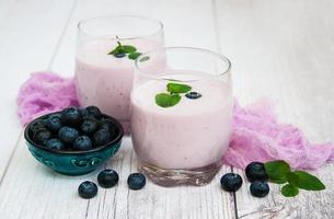 Glasses with blueberry yogurt on a table photo