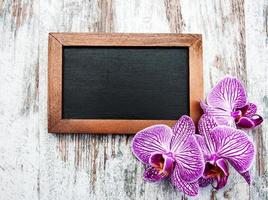 Blackboard and orchids photo