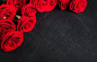 Red roses on a stone background photo