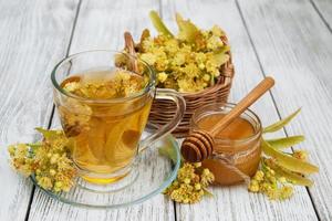 cup of herbal tea with linden flowers photo