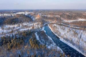 Winter in Sigulda, Latvia. River Gauja and Turaida Castle in background.