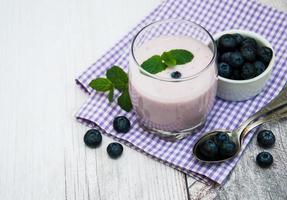 Glass with blueberry yogurt photo