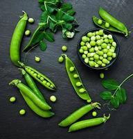 green peas on a stone background photo