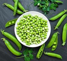 green peas on a stone background photo
