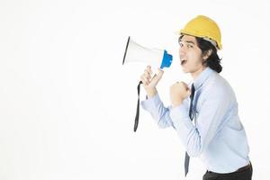 Young engineering man is announcing with megaphone photo