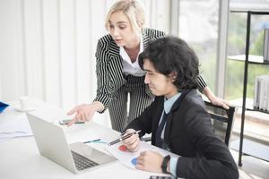 Business people are analyzing financial report photo