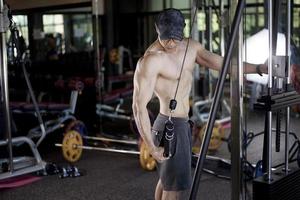 A fitness man work out in the gym photo