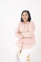 Asian older woman on white background photo