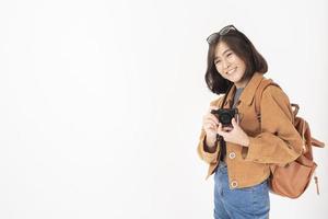 Beautiful young asian tourist woman happy on white background studio photo