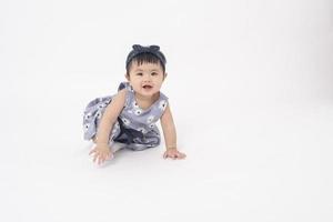 Adorable Asian baby girl is portrait on white background photo