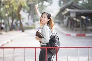 Happy young Asian University student. photo