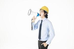 Young engineering man is announcing with megaphone photo