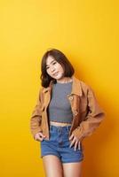 Beautiful asian woman University student happy on yellow background photo