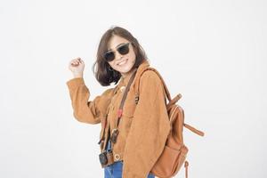 Beautiful young asian tourist woman happy on white background studio photo