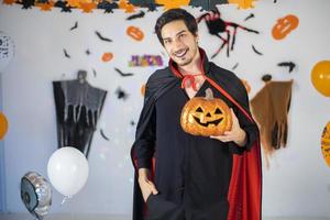 happy couple of love  in costumes and makeup on a celebration of Halloween photo