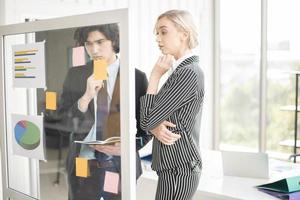 Business people are analyzing financial report photo