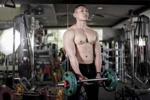 A fitness man work out in the gym photo