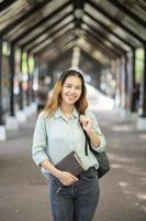 Happy young Asian University student. photo