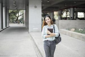 Happy young Asian University student. photo