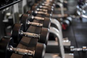 row of dumbbell in fitness gym