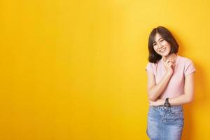 Beautiful asian woman University student happy on yellow background photo