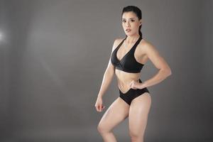 Beautiful fitness body builder woman in Studio