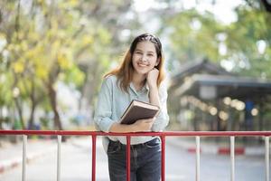 Happy young Asian University student.