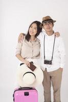 Asian couple tourists are enjoying  on white background photo