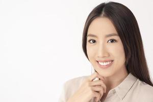 Close up of Asian woman with beautiful teeth on white background photo