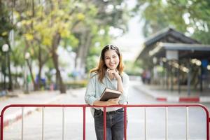 Happy young Asian University student. photo