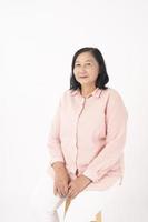 Asian older woman on white background photo