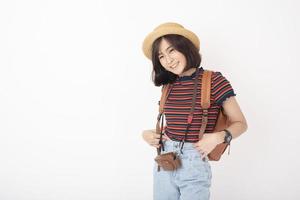 Beautiful young asian tourist woman happy on white background studio photo