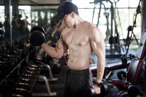 A fitness man work out in the gym photo