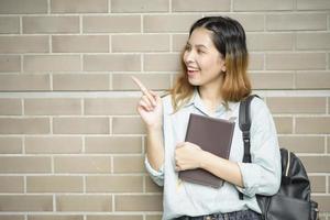 Happy young Asian University student. photo