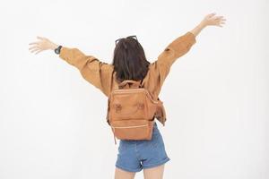 Beautiful young asian tourist woman happy on white background studio photo