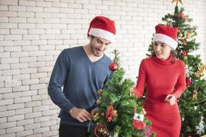 Attractive Caucasian couple of love are  celebrating Christmas in home photo