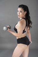 Beautiful fitness body builder woman in Studio