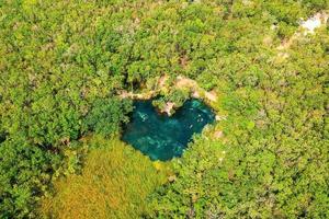 Heart shaped lake in the middle of a forest. Romantic concept. photo