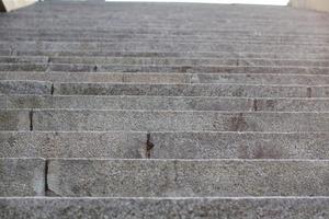 Abstract stairs in black and white, abstract steps, stairs in the city. Granite stairs,wIde stone stairway often seen on monuments and landmarks. Selective focus. photo